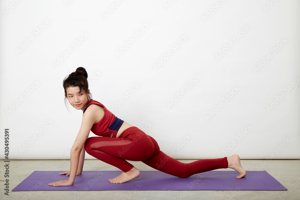 woman making yoga pose on mat woman making yoga pose on mat