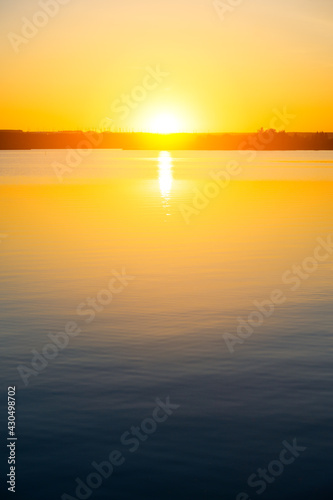 Summer sunset over the lake. Minimalistic landscape