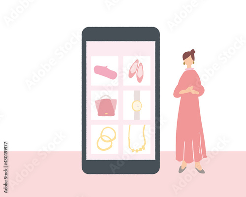 スマートフォンに映るネットショップ画面と横に立つ女性