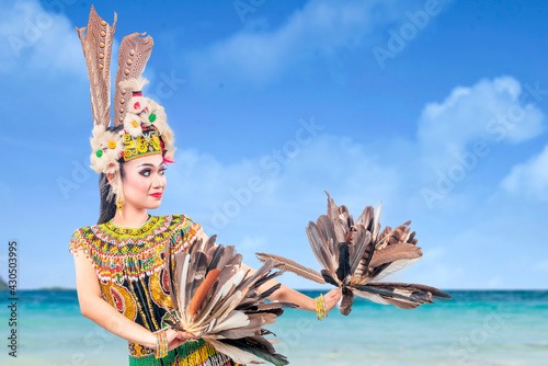 Asian woman dancing East Kalimantan traditional dance (Giring-Giring dance)