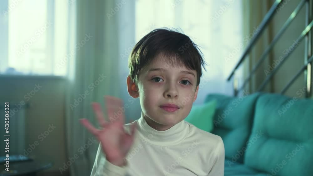 Little Boy Smiling Looking at Camera Waving Hand Close Up of a Cute Boy Face. Kid Portrait Positive Child Little Boy Smiling Looking at Camera Waving Hand Close Up of a Cute Boy Face. Kid Portrait Positive Child