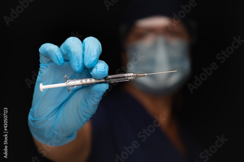 Doctor or Nurse Holding Med...