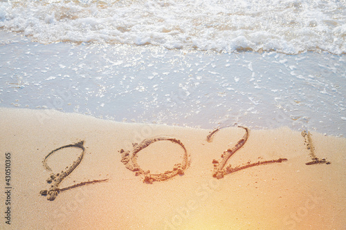 Happy New Year 2021 is coming concept sandy tropical ocean beach lettering