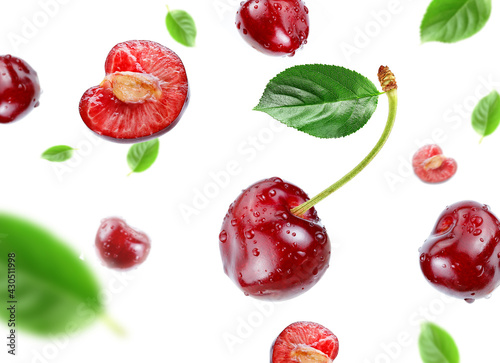Fototapeta Naklejka Na Ścianę i Meble -  red cherry with water drops flying in the air stream