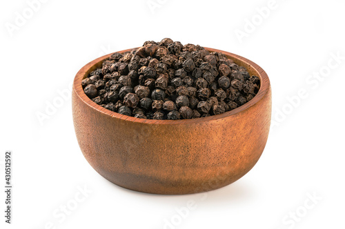 Black pepper in a wooden bowl isolated on white background.