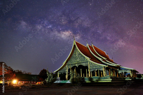 Beautiful night of the Milky way at Wat Sirindhorn Wararam or Wat Phu Prao in Ubon Ratchathani Province, Thailand