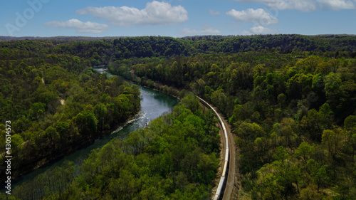 Aerial Over The River With Train
