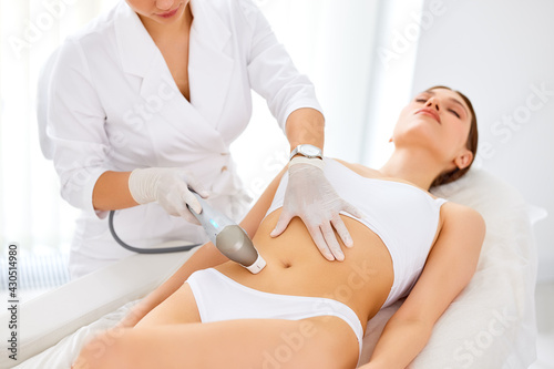 Woman getting laser hair removal procedure