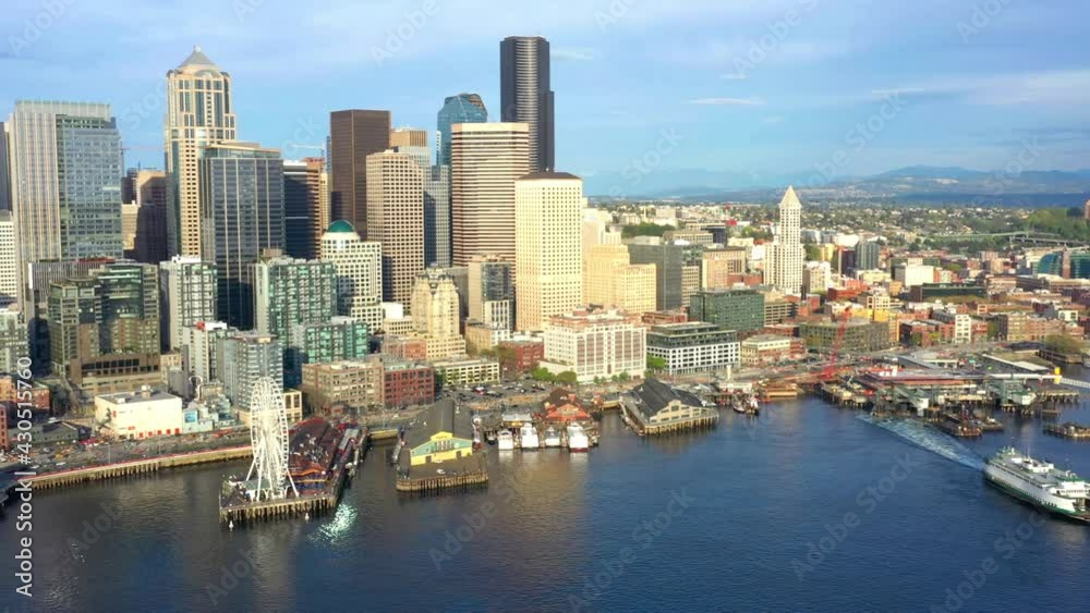 Aerial: Panning Left to Right on Seattle Waterfront with Ferry Departing Aerial: Panning Left to Right on Seattle Waterfront with Ferry Departing