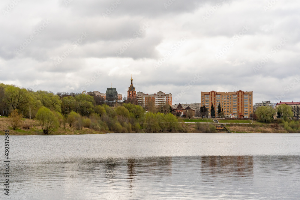 Lake on the background of the cathedral and city buildings
