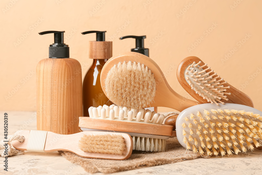 Composition with massage brushes and bath supplies on color background, closeup Composition with massage brushes and bath supplies on color background, closeup