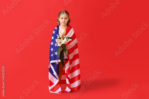 Little girl with USA flag a...