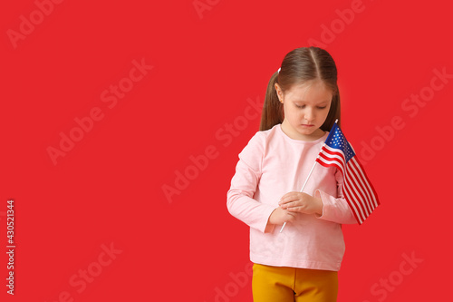 Little girl with USA flag o...