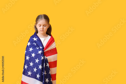 Little girl with USA flag o...