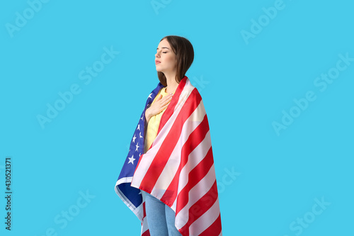 Sad young woman with USA fl...