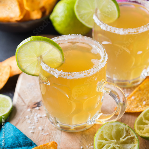 Mexican alcohol cocktail chelada with light beer and lime juice