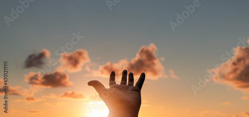 Silhouettes of hot air balloon at sunset sky background .