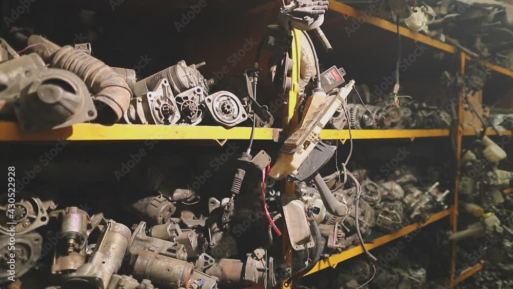 Warehouse of used car parts of old cars at the mechanical parts factory, auto parts piles