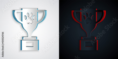 Paper cut Pet award symbol icon isolated on grey and black background. Medal with dog footprint as pets exhibition winner concept. Paper art style. Vector