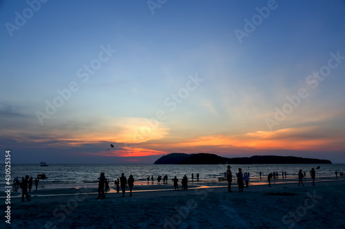 Langkawi  Malaysia  6 March 2018  Silhouette of people enjoying the beach during sunset at Chenang Beach  Langkawi.