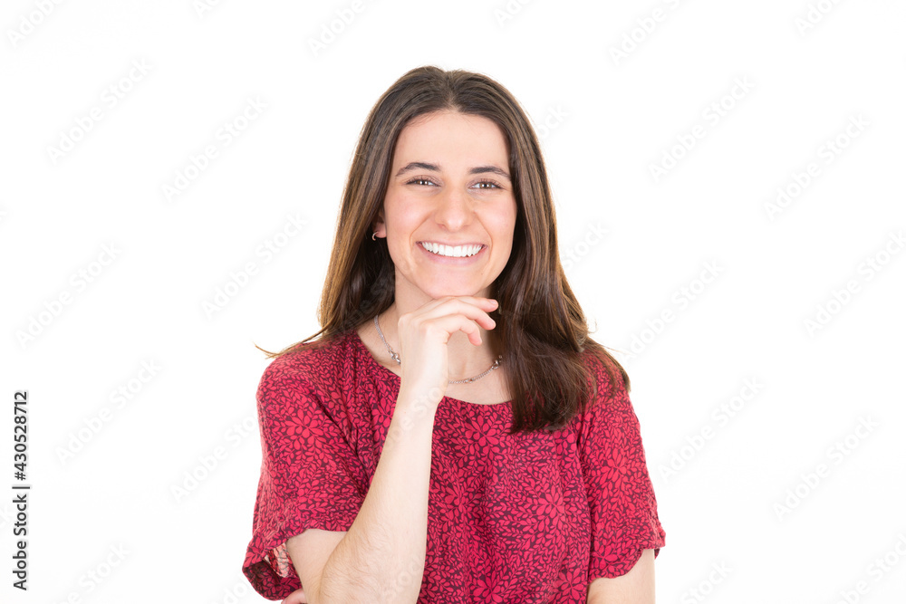 beautiful young woman model looking at camera with charming cute smile posing over white copy space wall beautiful young woman model looking at camera with charming cute smile posing over white copy space wall