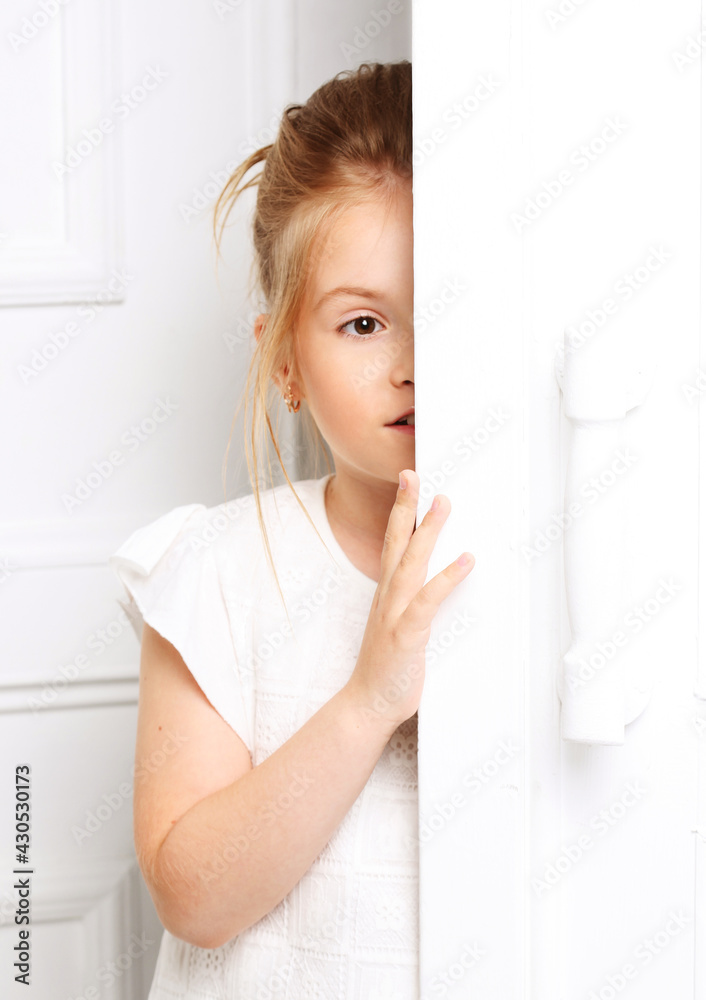 Children's fashion. A beautiful, thoughtful serious blonde girl Children's fashion. A beautiful, thoughtful serious blonde girl