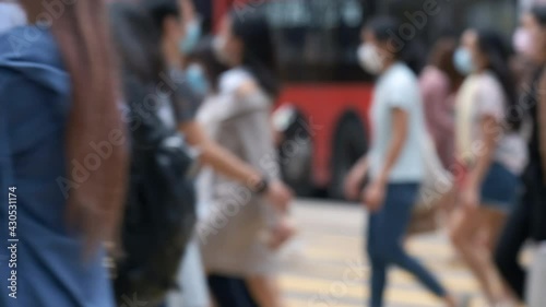 Slow motion of unrecognized people wearing medical face mask in Hong Kong. Coronavirus concept
