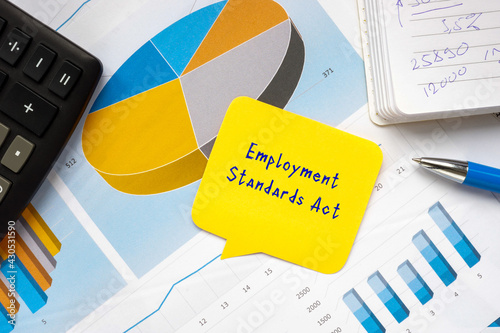 Conceptual photo about Employment Standards Act with handwritten phrase. photo