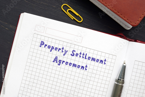 Legal concept about Property Settlement Agreement with inscription on the piece of paper.