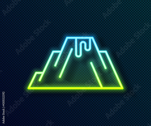 Glowing neon line Volcano eruption with lava icon isolated on black background. Vector