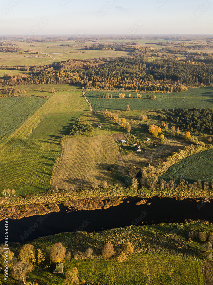 Aerial view of river Venta in sunny autumn evening, Latvia.