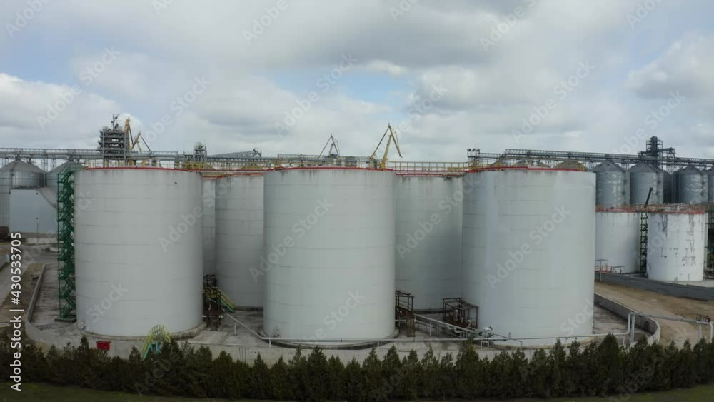 Aerial view of Chemical industry storage tank and tanker truck In waiting in Industrial Plant Aerial view of Chemical industry storage tank and tanker truck In waiting in Industrial Plant