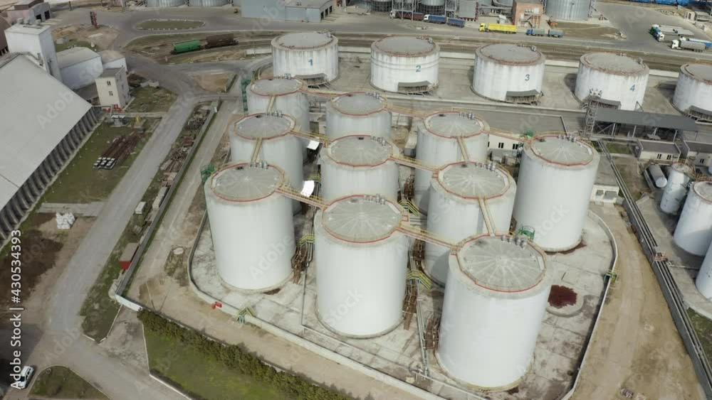 Aerial view of Chemical industry storage tank and tanker truck In waiting in Industrial Plant Aerial view of Chemical industry storage tank and tanker truck In waiting in Industrial Plant