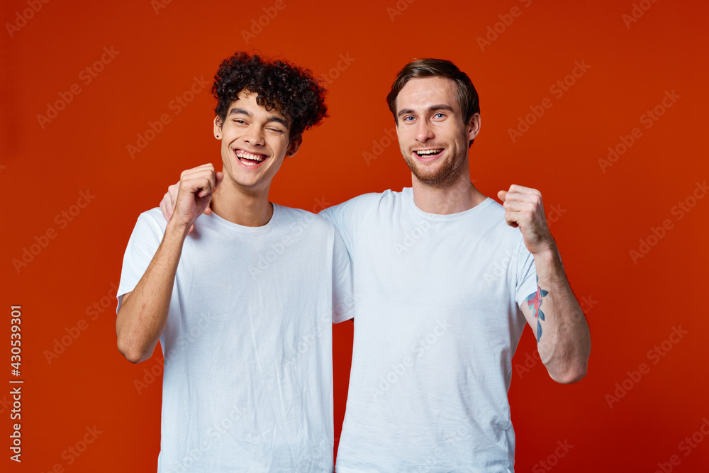 two man in white t-shirts fun emotions hand gestures friendship hugs two man in white t-shirts fun emotions hand gestures friendship hugs