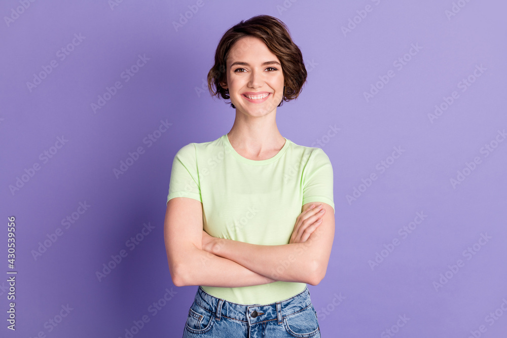 Portrait of attractive content cheerful girl folded arms isolated over bright violet purple color background Portrait of attractive content cheerful girl folded arms isolated over bright violet purple color background