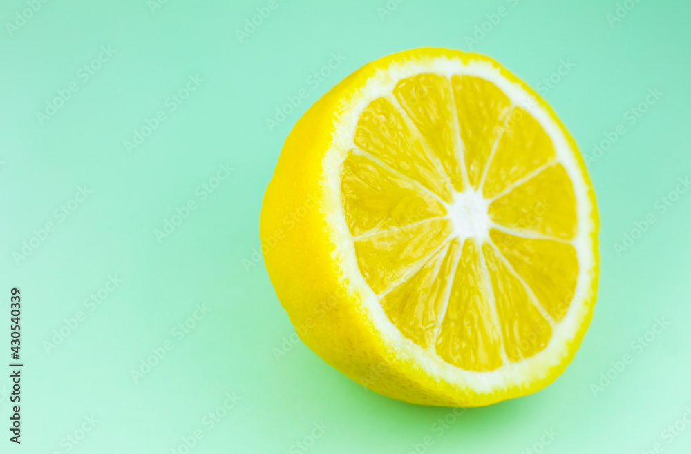 Close up photo of lemon texture on the blue background. Fruit cut in half, inside, macro view. Beautiful natural wallpaper. Close up photo of lemon texture on the blue background. Fruit cut in half, inside, macro view. Beautiful natural wallpaper.