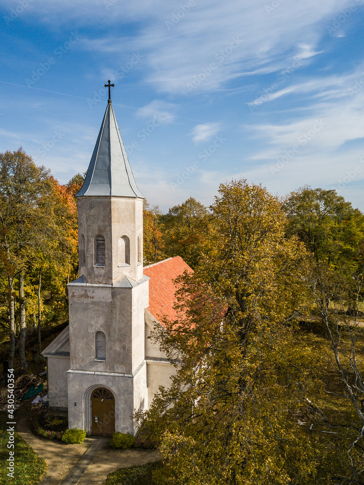 Fototapeta premium Aerial view of Renda lutheran church in sunny autumn day, Latvia.