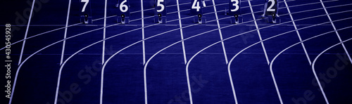 Starting blocks in track and field. Professional sport concept. Blue color filter