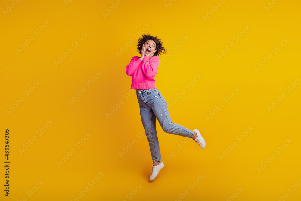 Portrait of active positive girl jumping have weekend free-time fun isolated on yellow background