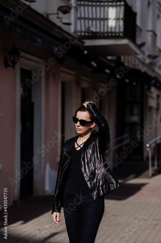 brunette woman walking in city © jozzeppe777