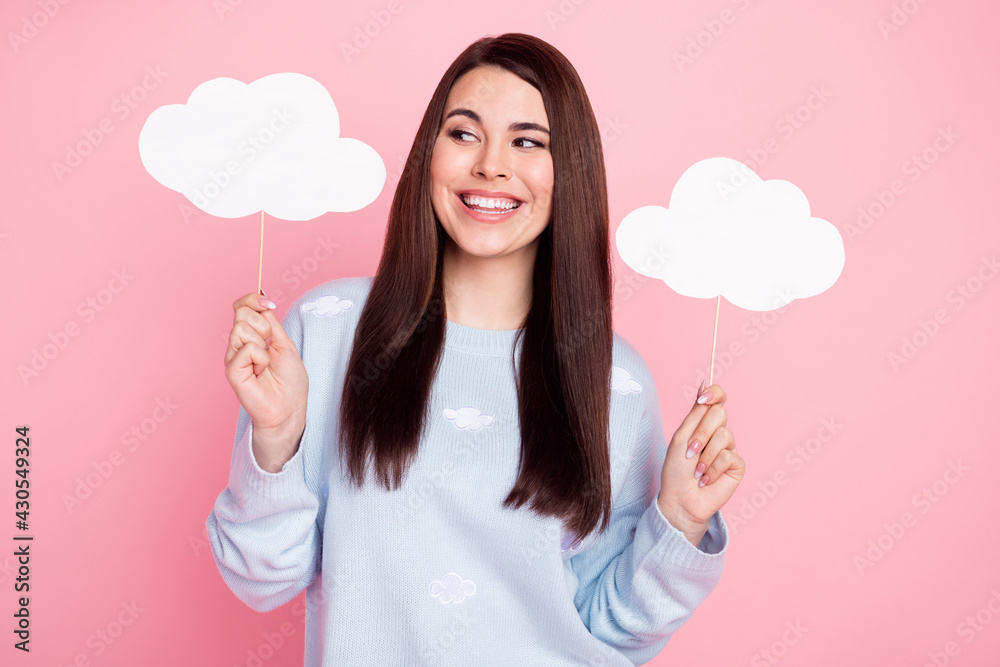 Photo of nice optimistic long hairdo brunette lady look cloud wear blue sweater isolated on pink background Photo of nice optimistic long hairdo brunette lady look cloud wear blue sweater isolated on pink background