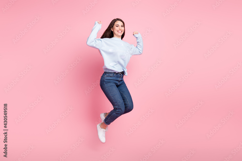 Full size profile photo of nice optimistic long hairdo brunette lady jump wear blue sweater isolated on pink background