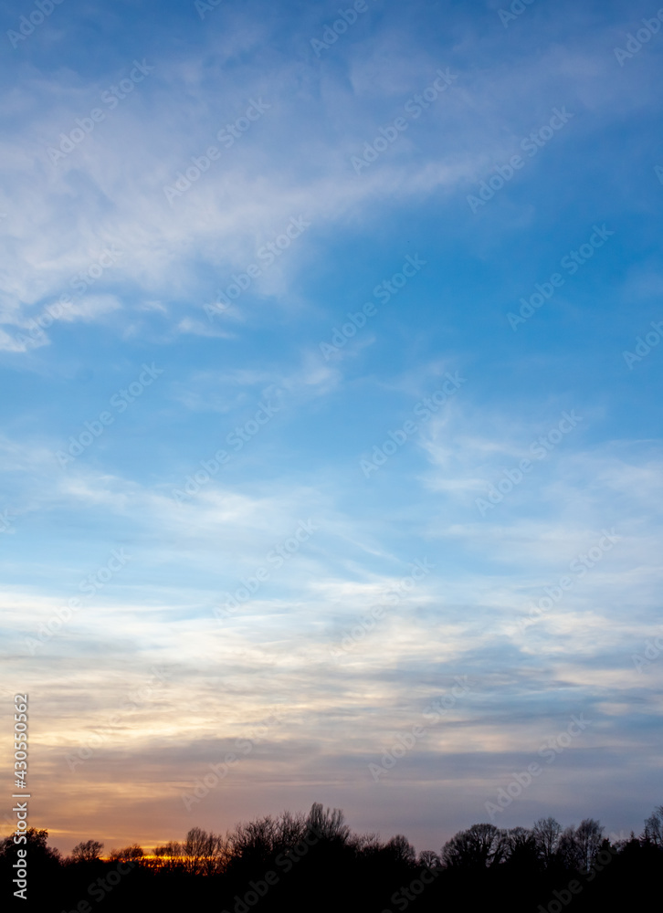 Sunset in the sky with a dark silhouette 