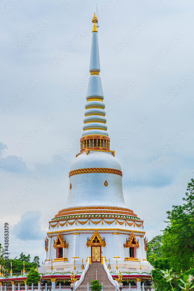 Naklejka premium White pagoda at Wat Tham Muninat (Wat Ruesi) near the road go to the giant rain tree in kanchanburi Thailand