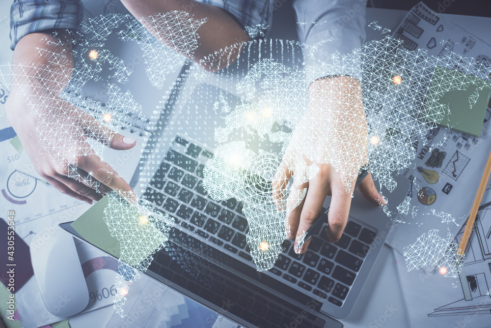 Double exposure of man and woman working together and business theme hologram drawing. Computer background. Top View. Double exposure of man and woman working together and business theme hologram drawing. Computer background. Top View.