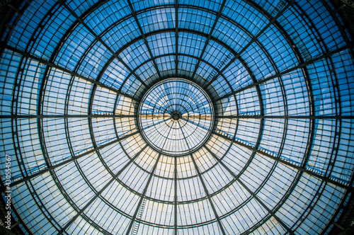 Abstract circular pattern of the glass dome of the Galleria Vittorio Emanuele II in Milan, Lombardy, Italy.