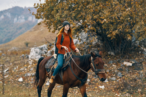 woman hiker riding horse mountains landscape travel adventure © SHOTPRIME STUDIO