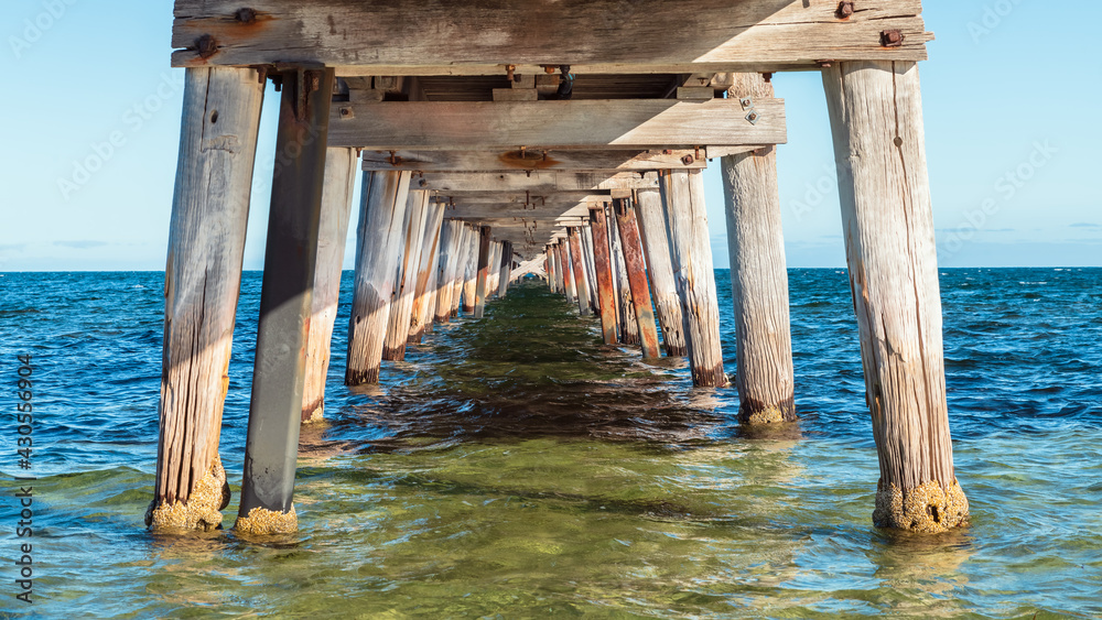 Marion Bay view from under jetty at sunset time during summer season, Yorke Peninsula, South Australia