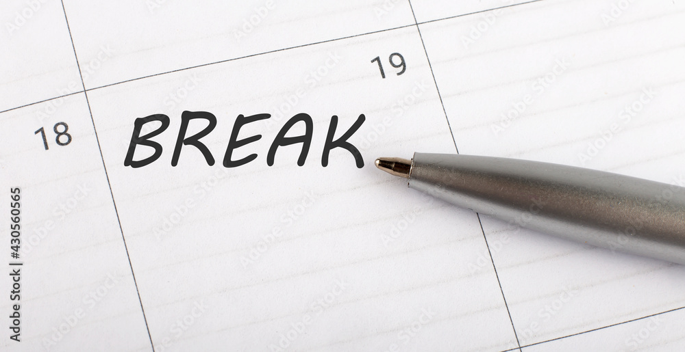 Text BREAK written on calendar planner to remind you an important appointment with a pen on isolated white background. Text BREAK written on calendar planner to remind you an important appointment with a pen on isolated white background.