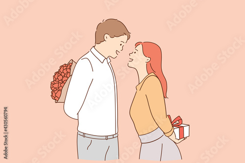 Love, valentines day and romantic dating concept. Young loving man and woman cartoon characters standing and preparing gifts for each other for holiday during date vector illustration 